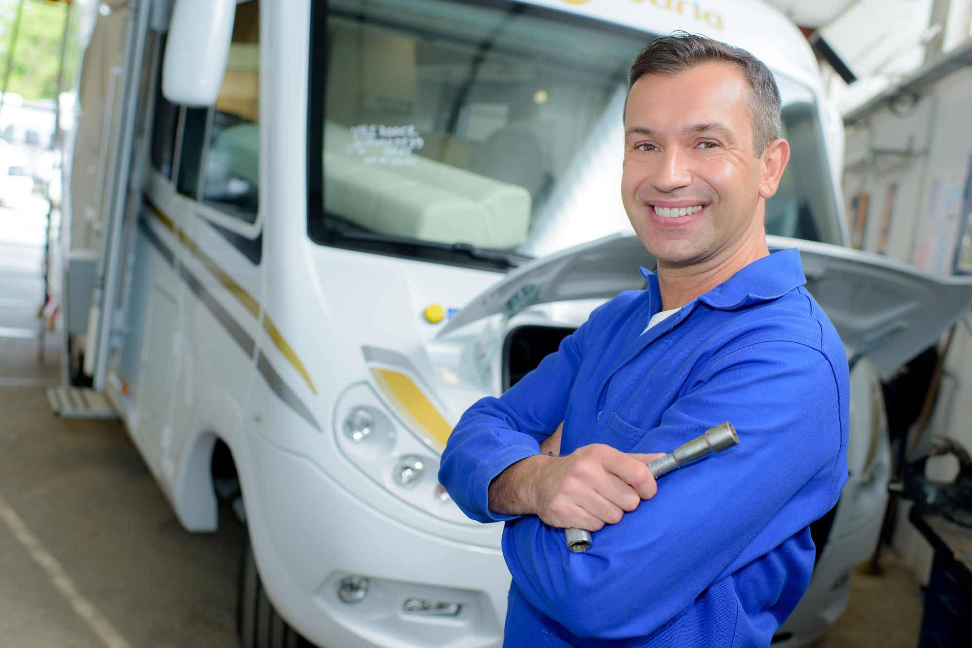 man performing RV maintenance