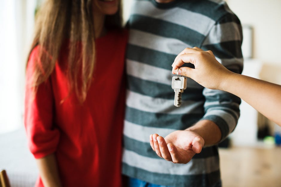 couple accepting car keys
