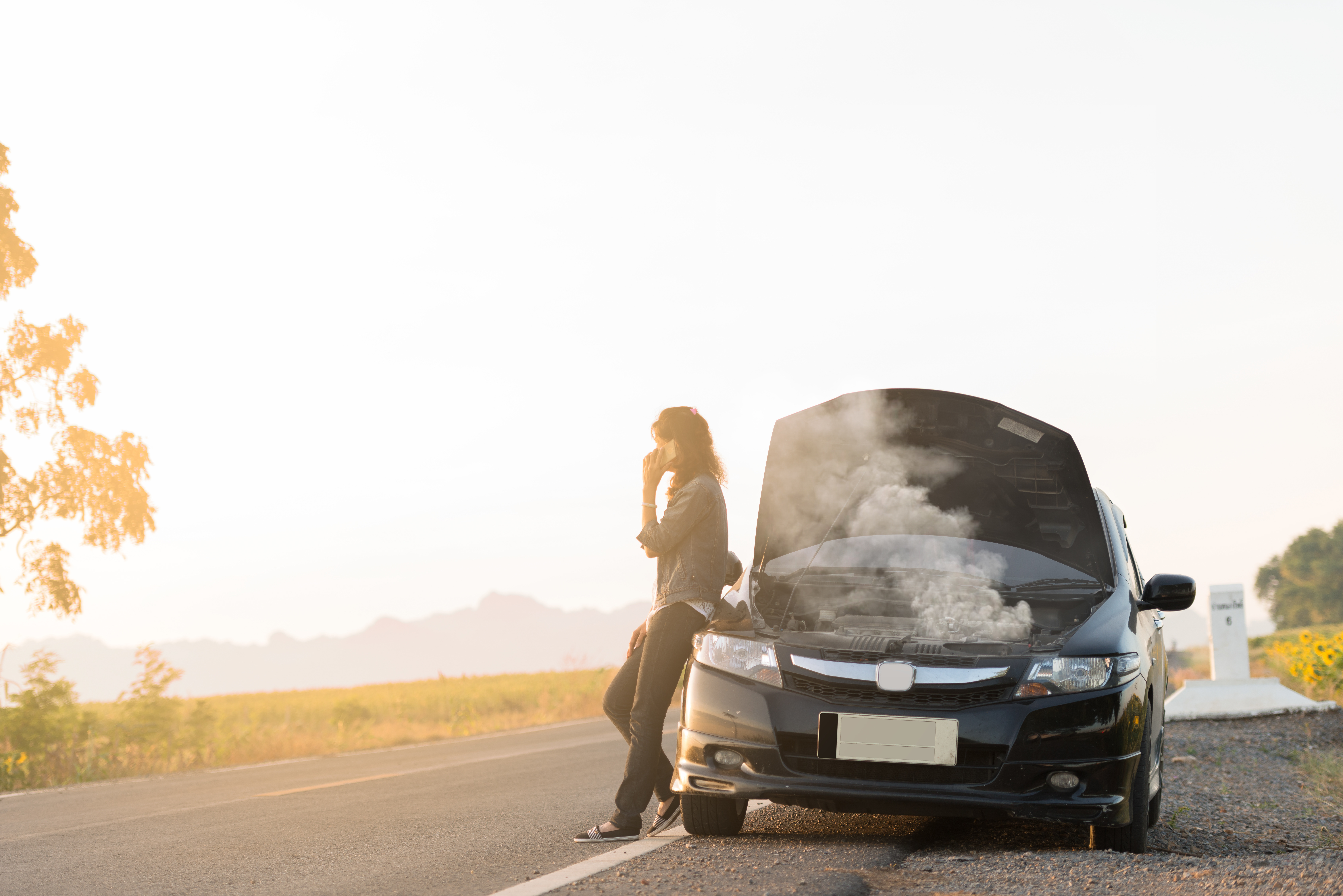 woman with broken down car