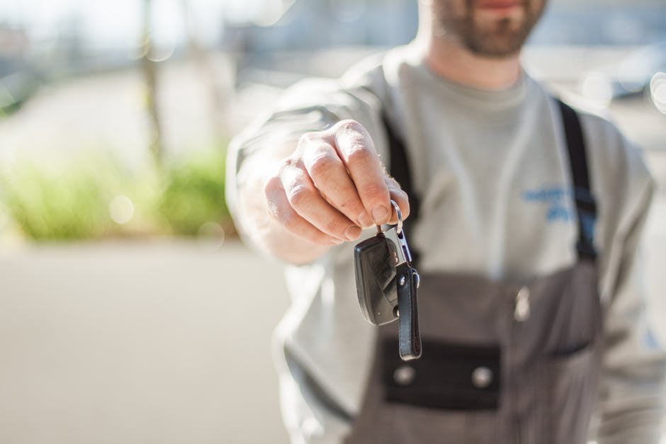 person holding car keys