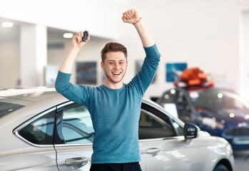 man buying car at dealership