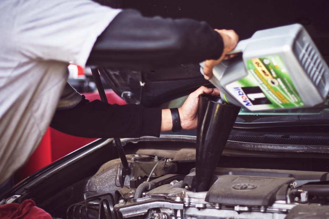 mechanic doing oil change