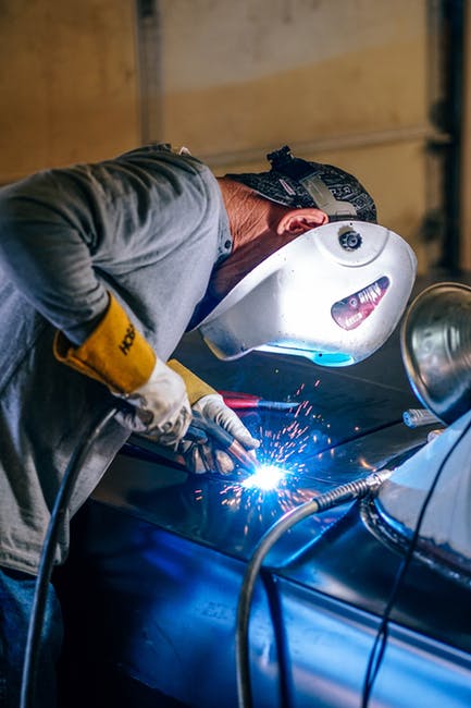 auto repair tech working on car