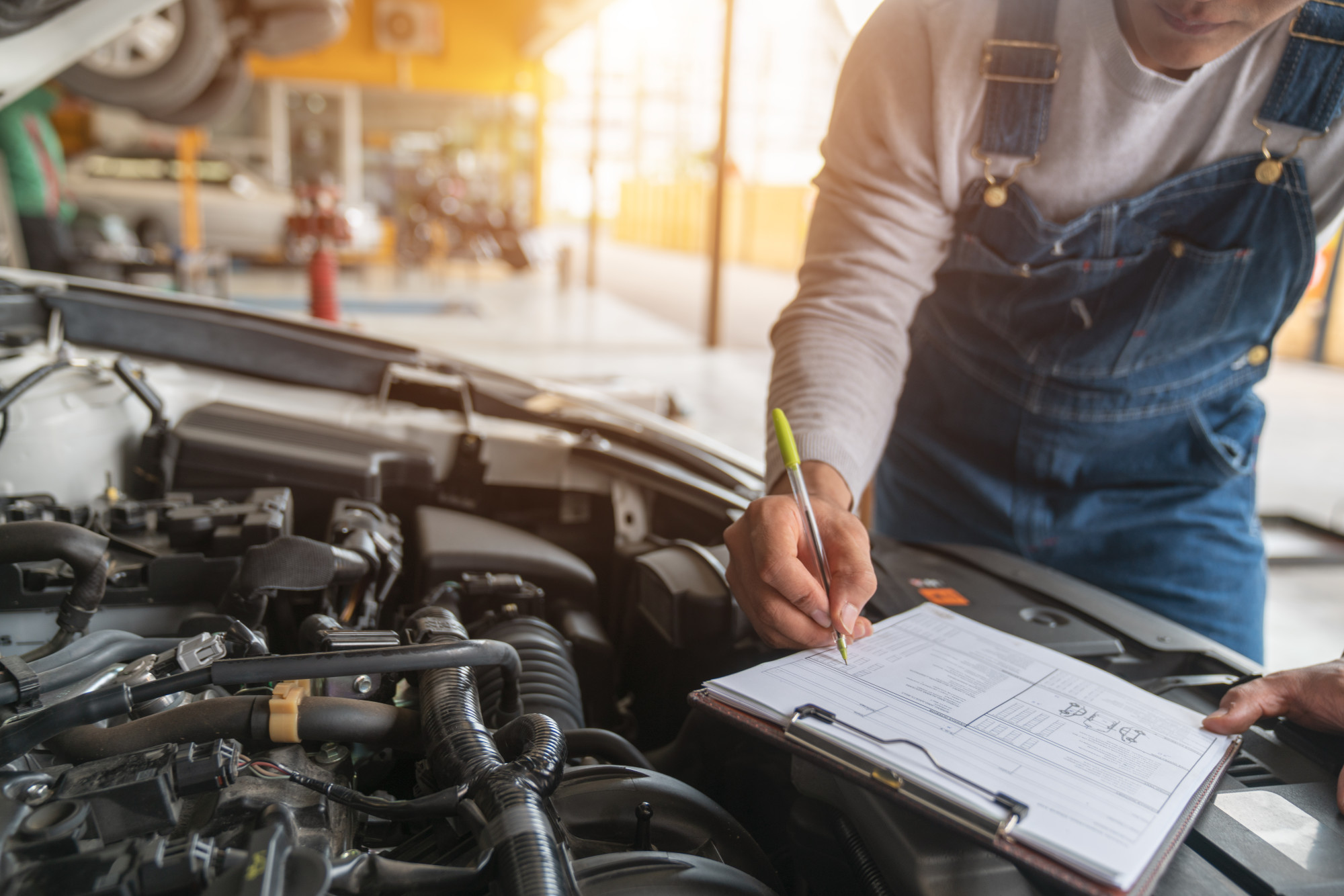 car mechanic with clipboard