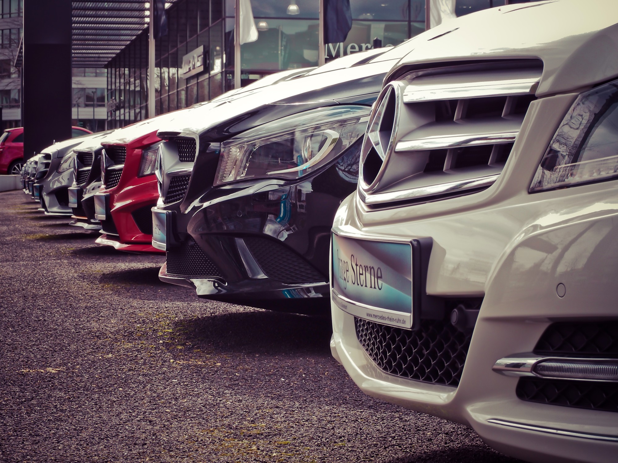 new cars in a row at dealership