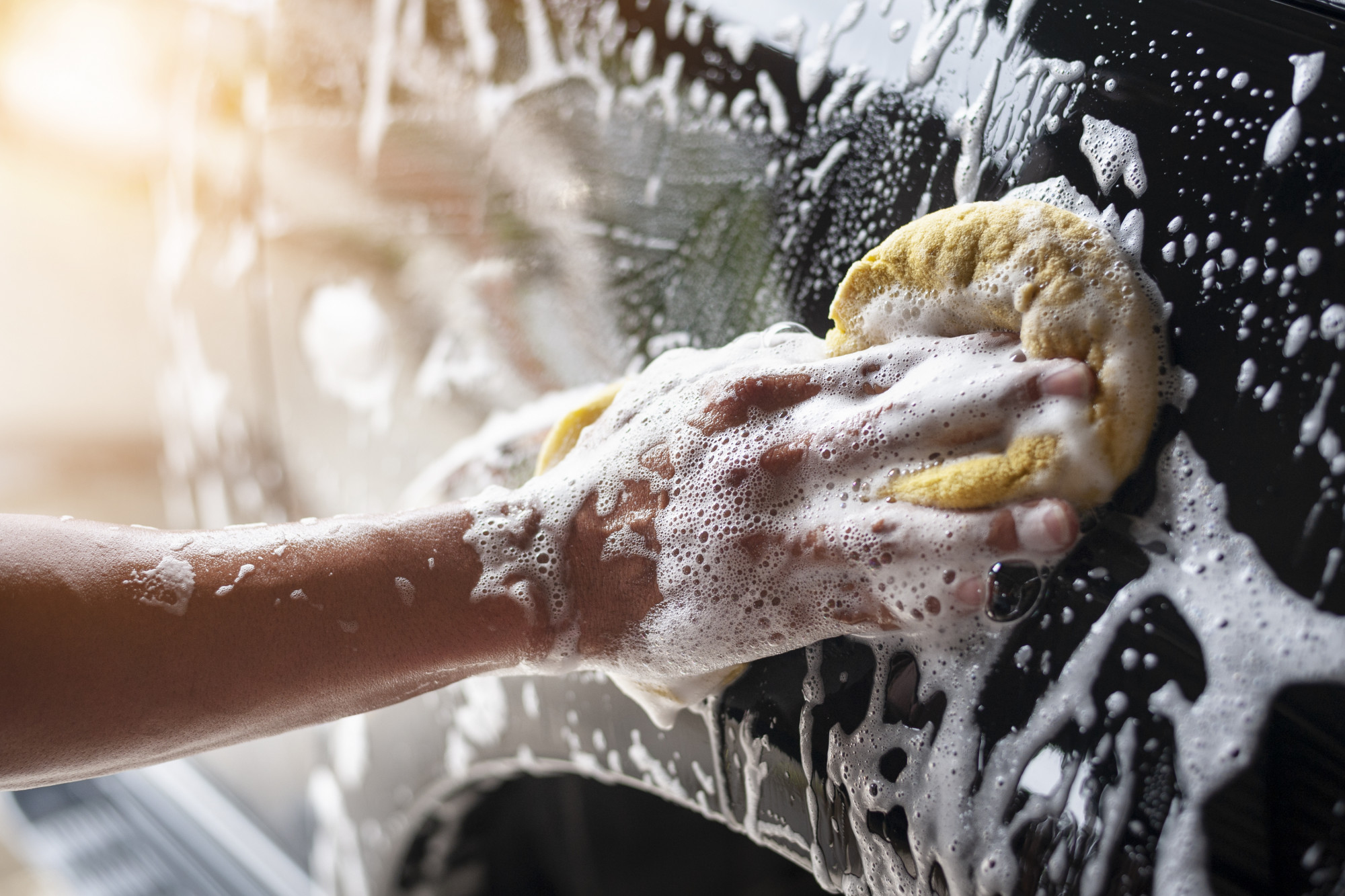 person washing a car