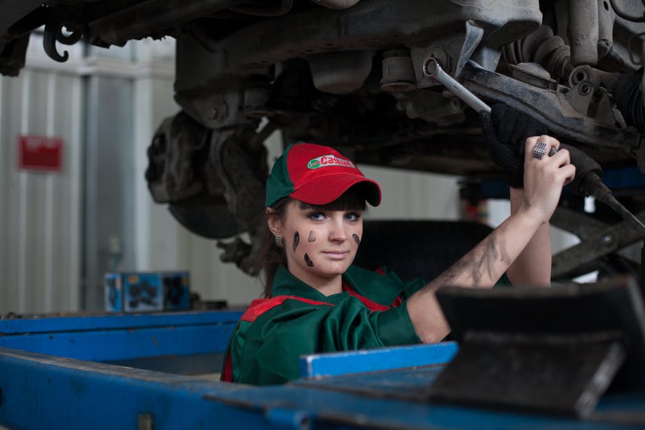 mechanic working on vehicle