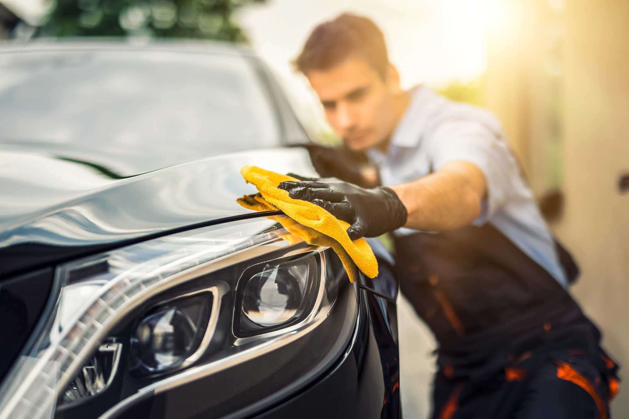 Person Buffing the Exterior of a Car