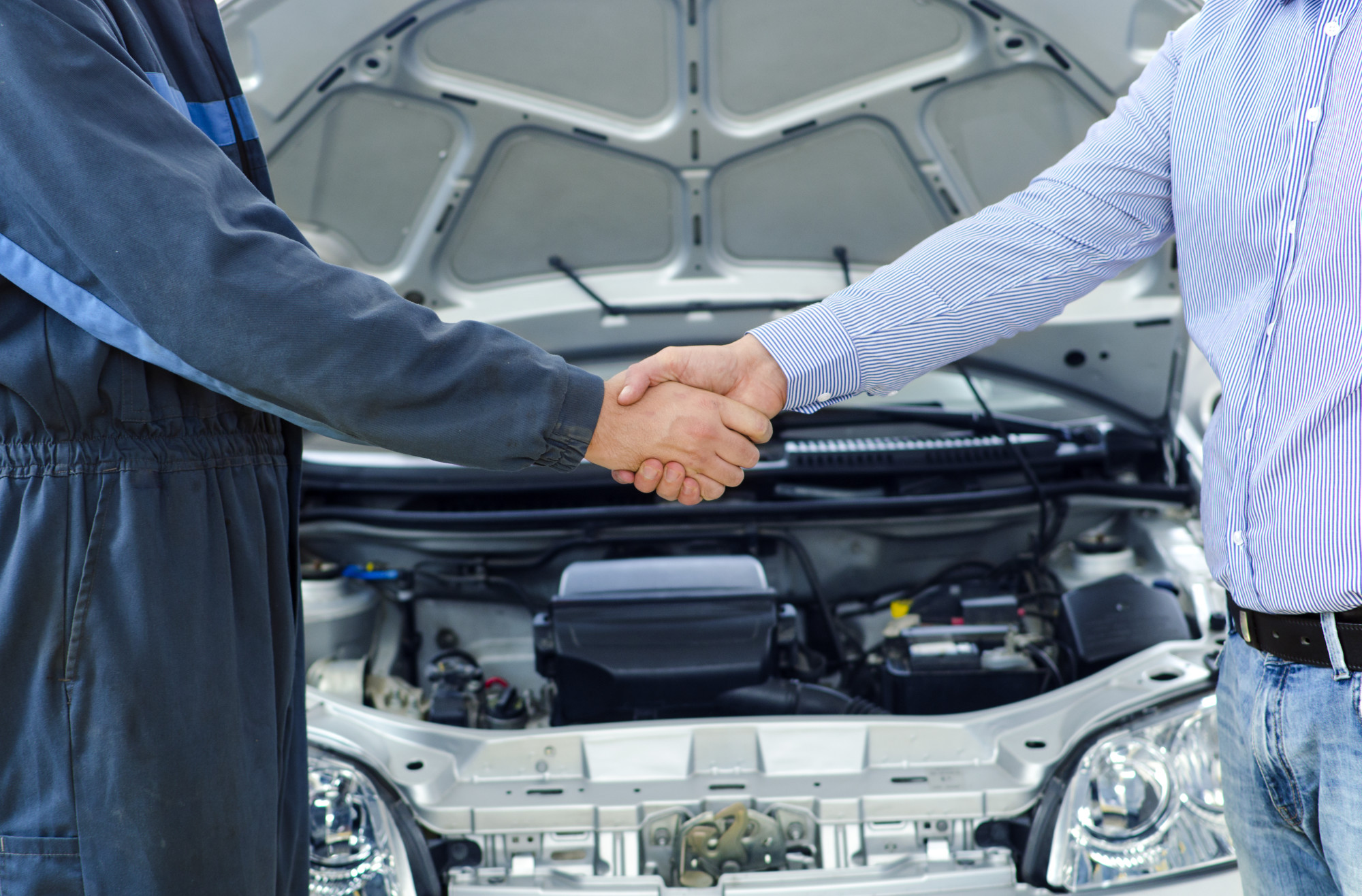 Customer Shaking Hand of Mechanic After a Car Repair